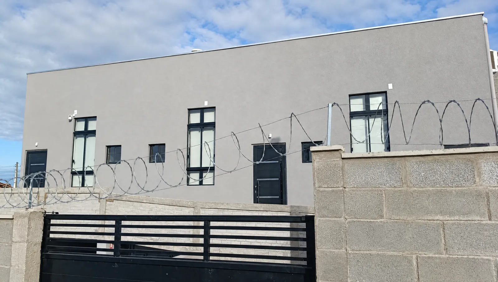 Street front with the gated entrance