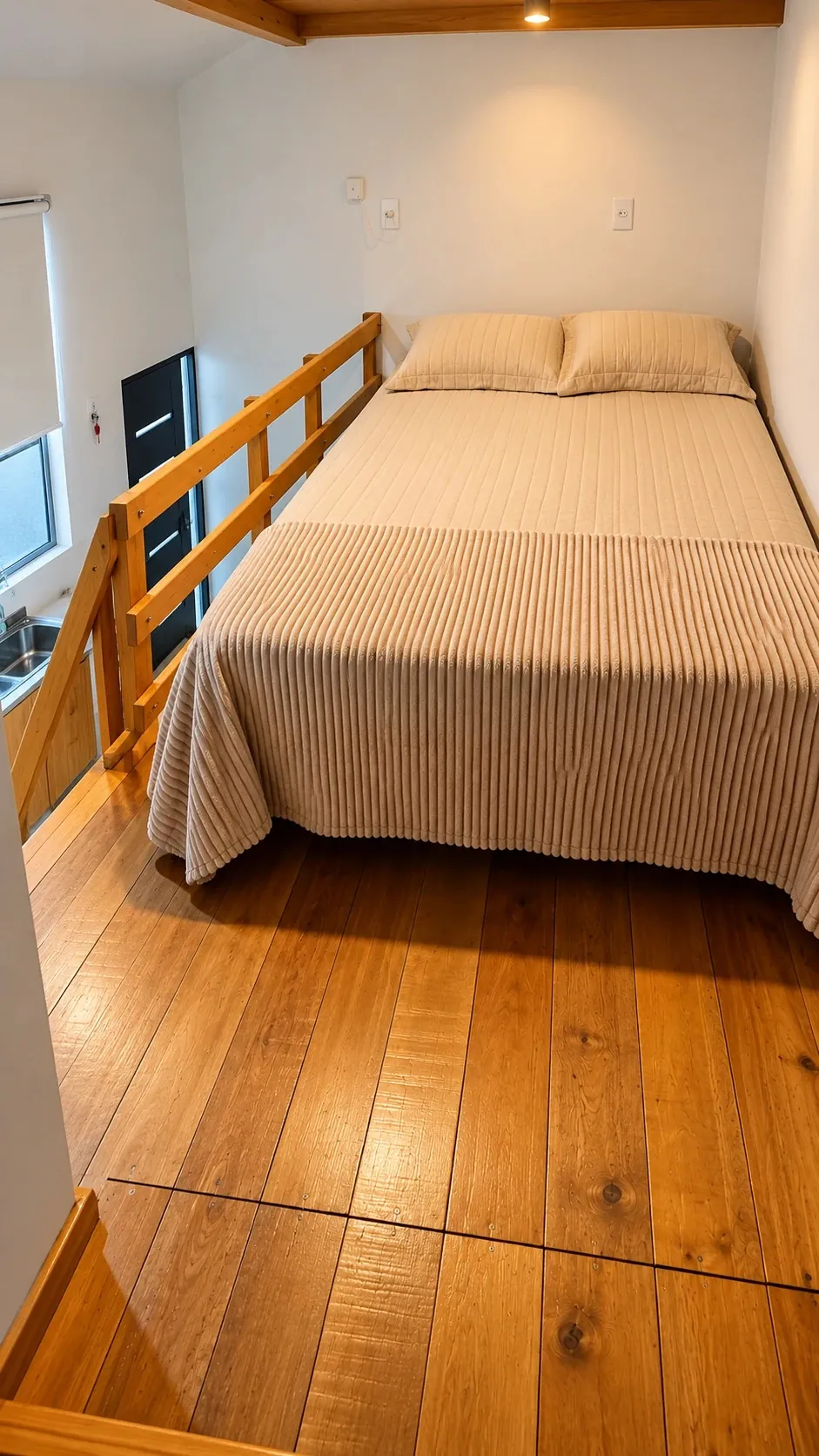 Studio 3 — the sleeping loft, looking down to the entrance