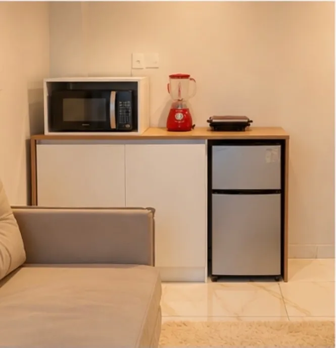 Studio 3 — kitchenette with microwave and compact fridge