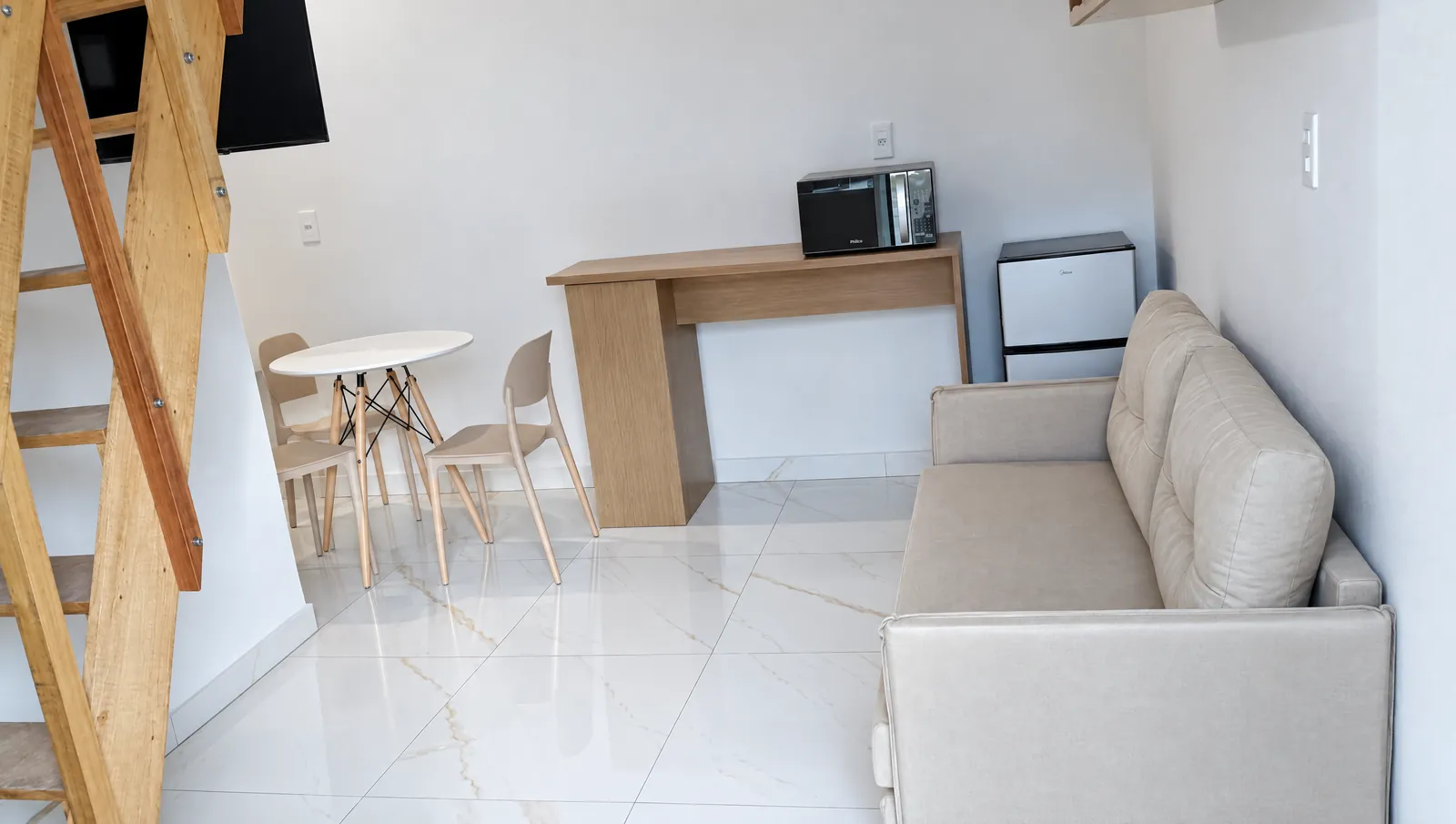 Studio 2 — living and dining, ladder on the left
